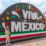 Shelli in front of the Viva Mexico Sign in Queretaro